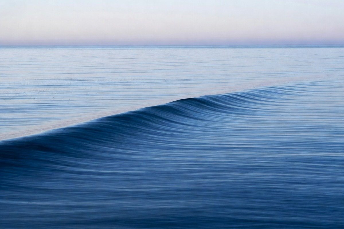 A cold glassy ocean swell in the morning